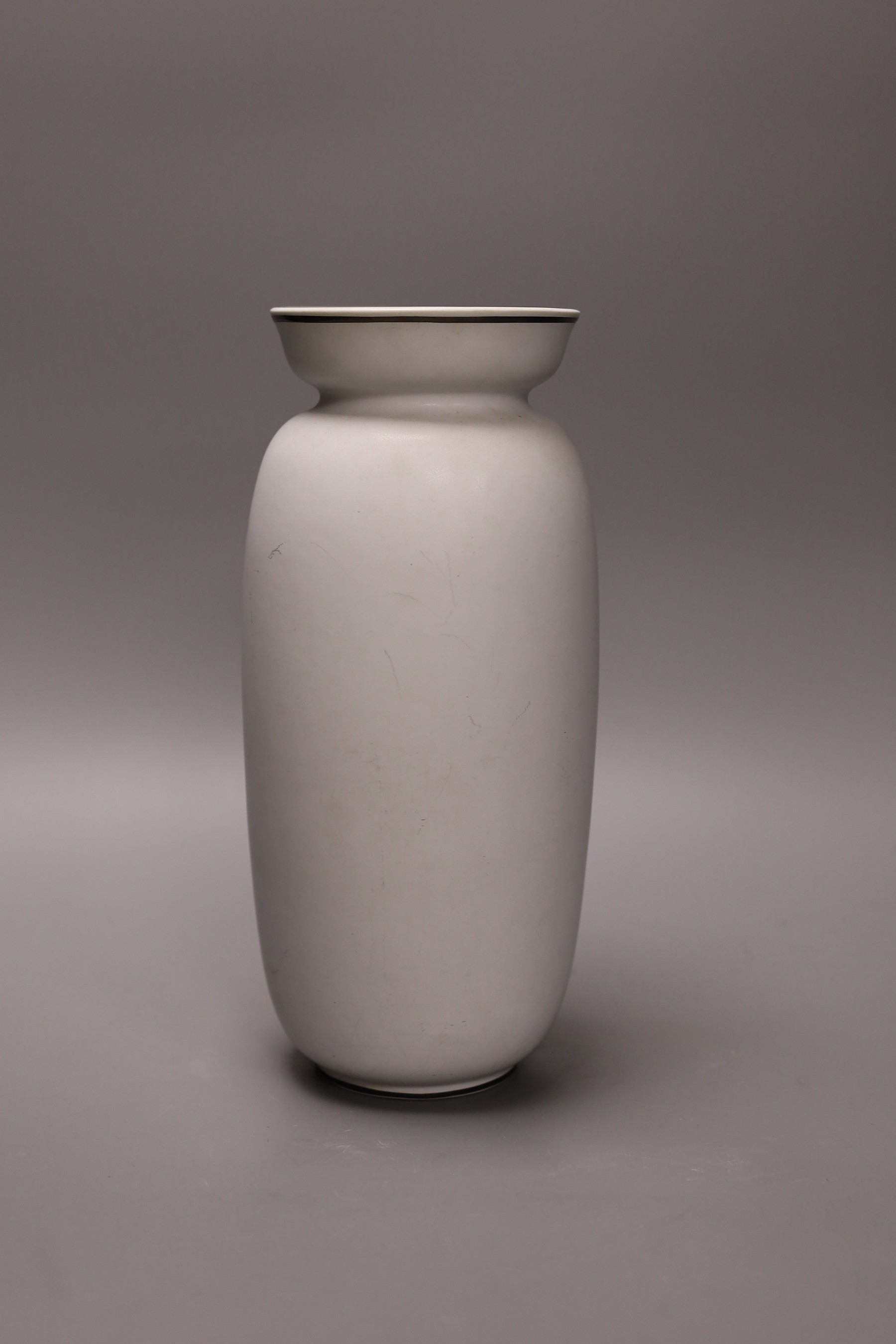 A large Gustavsberg Stig Lindberg 220 shape Grazia vase decorated with a woman's face, inscribed Harry Askne to the base, 27cm